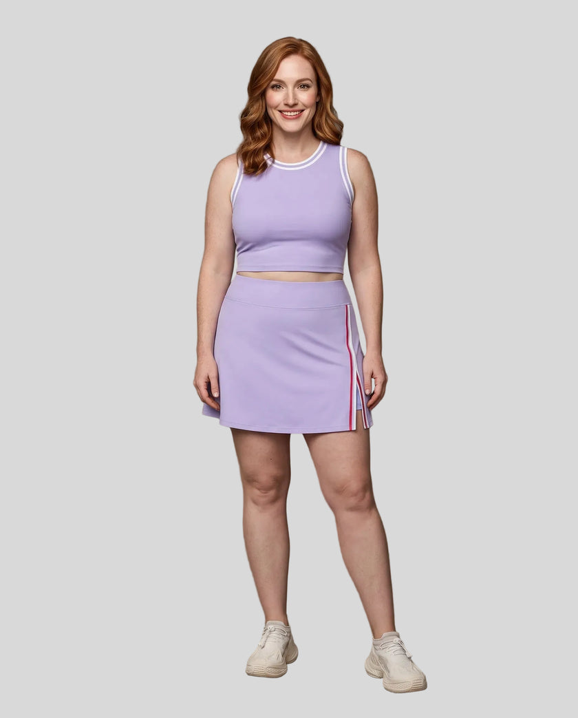 Front view of Model wearing the TrackLine Rally Tank in Lavender with White, paired with Trackline Rally Slit Skirt in Lavender.