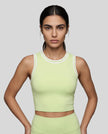 Model wearing the TrackLine Rally Tank in Light Green with White, front view.
