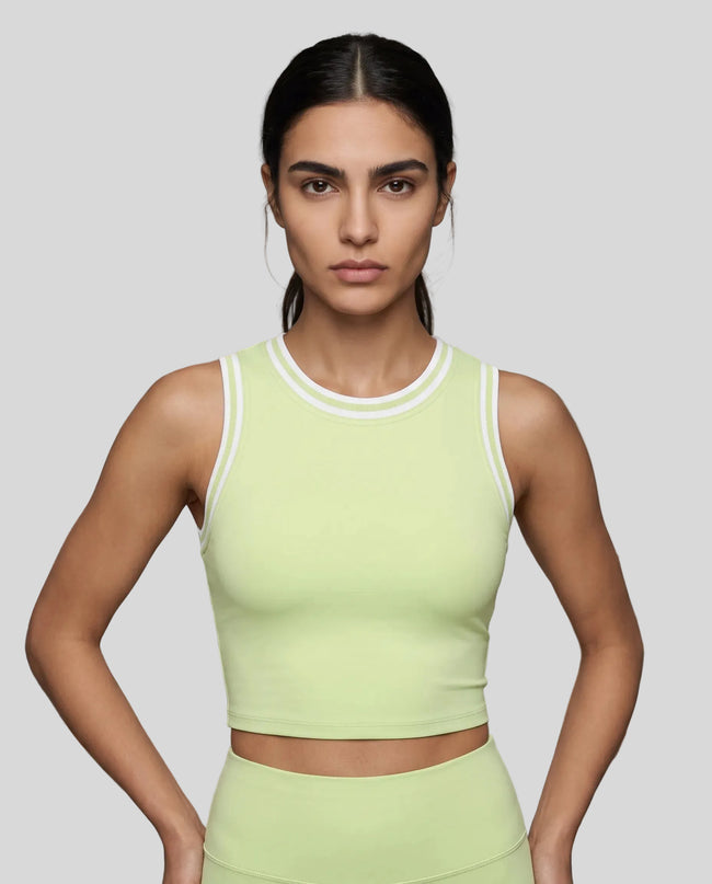 Model wearing the TrackLine Rally Tank in Light Green with White, front view.