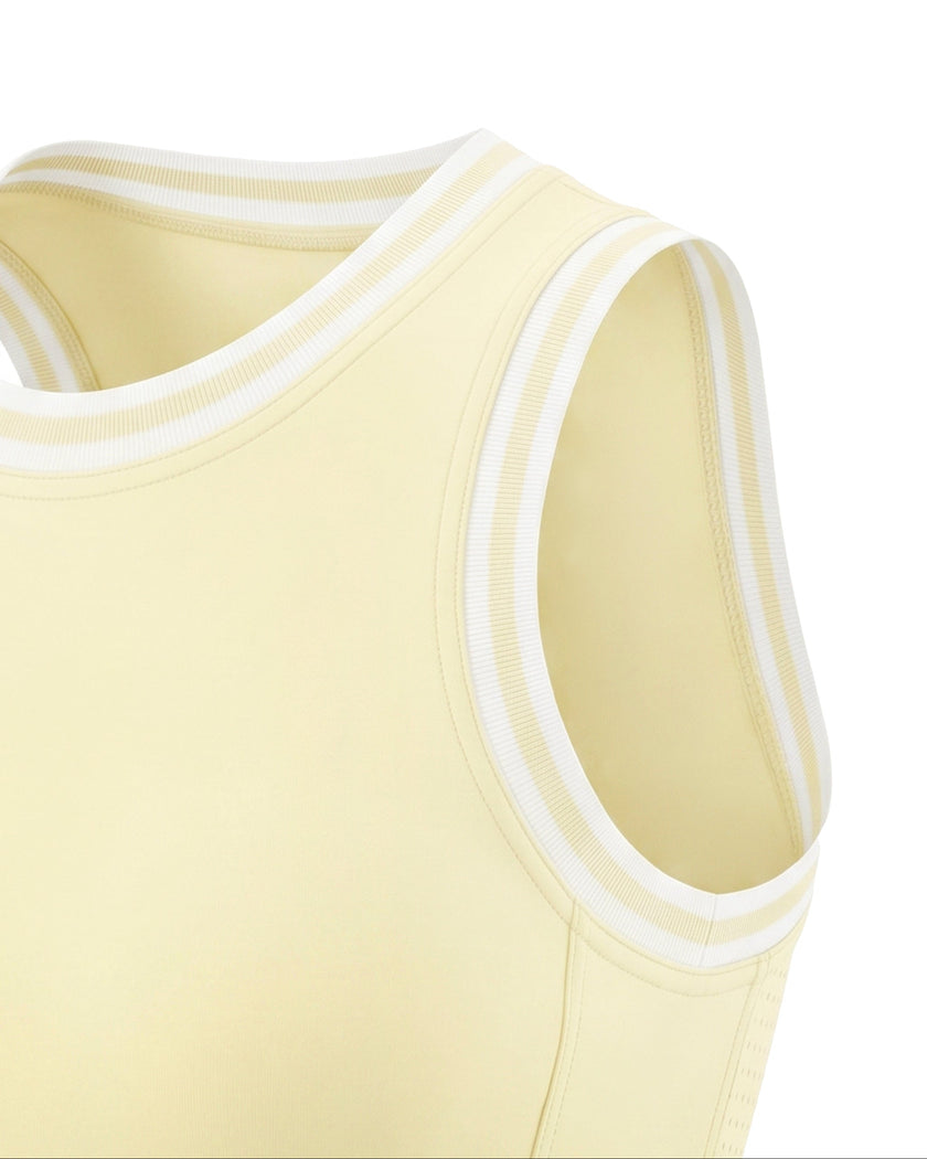 Contrast trim detail around the neckline and armhole of the TrackLine Rally Tank in Light Yellow with White