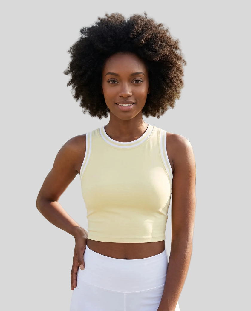 Model wearing the TrackLine Rally Tank in Light Yellow with White, front view.