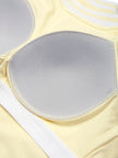 Interior removable padding detail of the TrackLine Rally Tank in Light Yellow with White