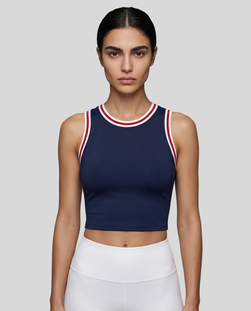 Model wearing the TrackLine Rally Tank in Navy Blue with Red, front view.
