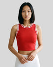 Model wearing the TrackLine Rally Tank in Red with White, front view.