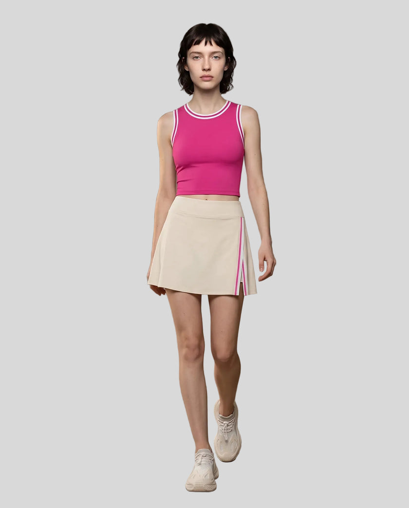 Front view of Model wearing the TrackLine Rally Tank in Rose Red with White, paired with Trackline Rally Slit Skirt in Light Apricot.