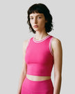 Model wearing the TrackLine Rally Tank in Rose Red with White, front view.