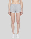 Model wearing TrackLine Retro Shorts in Flower Gray with White contrast binding front view