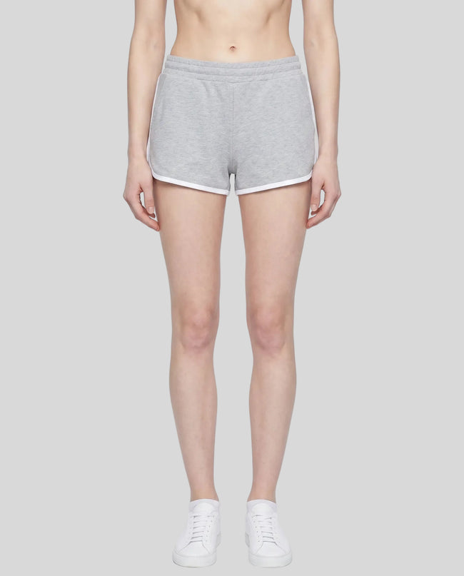 Model wearing the Athlesi TrackLine Retro Shorts in flower gray and white front view