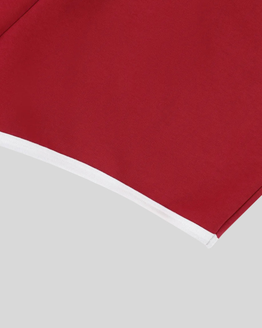 Leg hem and contrast binding detail of TrackLine Retro Shorts in Red