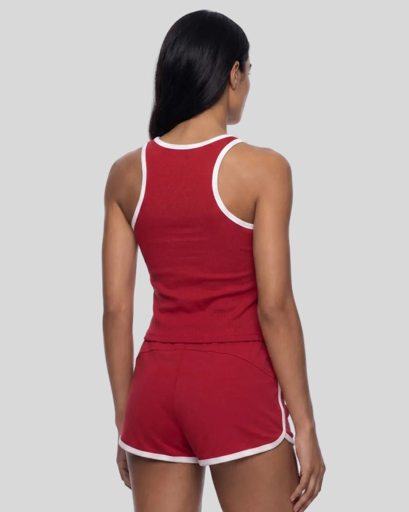 Back view of model wearing the Athlesi TrackLine Retro Tank in red and white with matching retro shorts