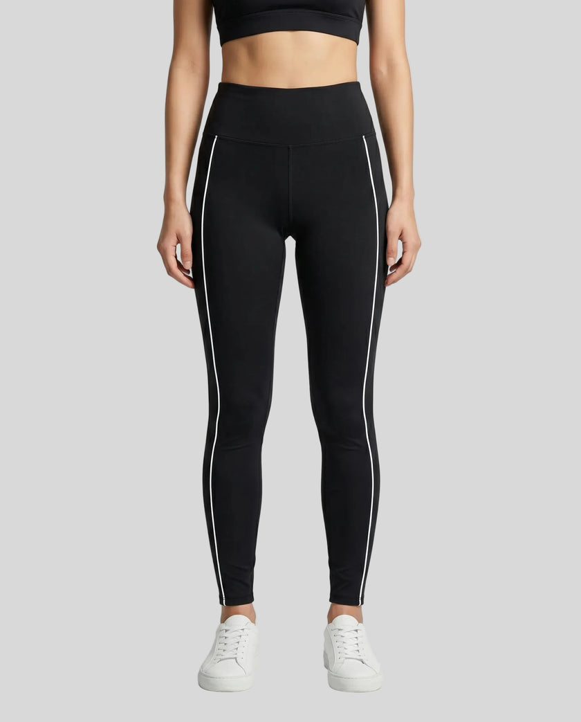 Model wearing the TrackLine Riviera Leggings in black front view