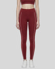 Model wearing the TrackLine Riviera Leggings in wine red front view