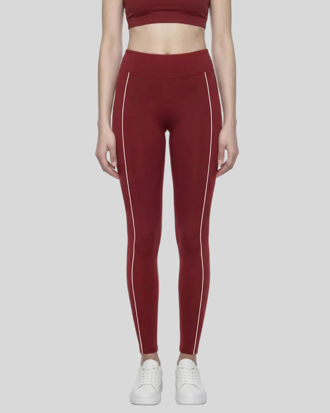 Model wearing the TrackLine Riviera Leggings in wine red front view