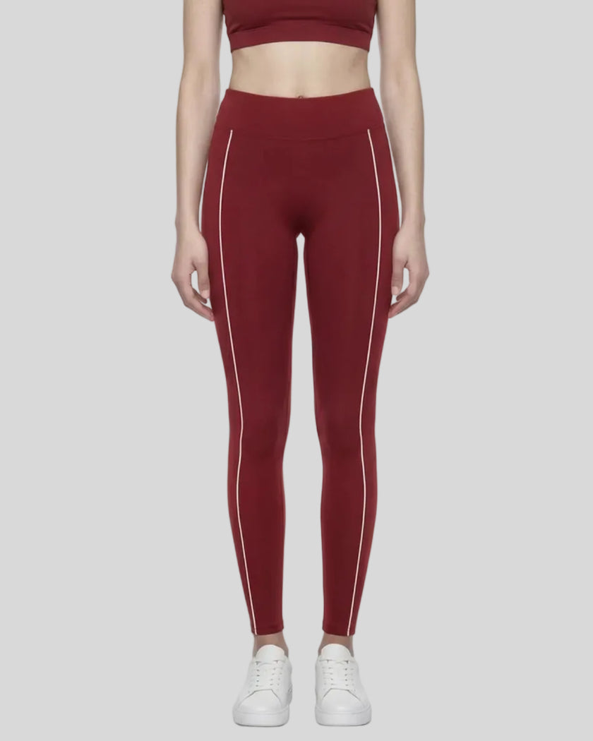 Model wearing the TrackLine Riviera Leggings in wine red front view