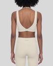 Back view of the TrackLine Riviera Sports Bra in light apricot