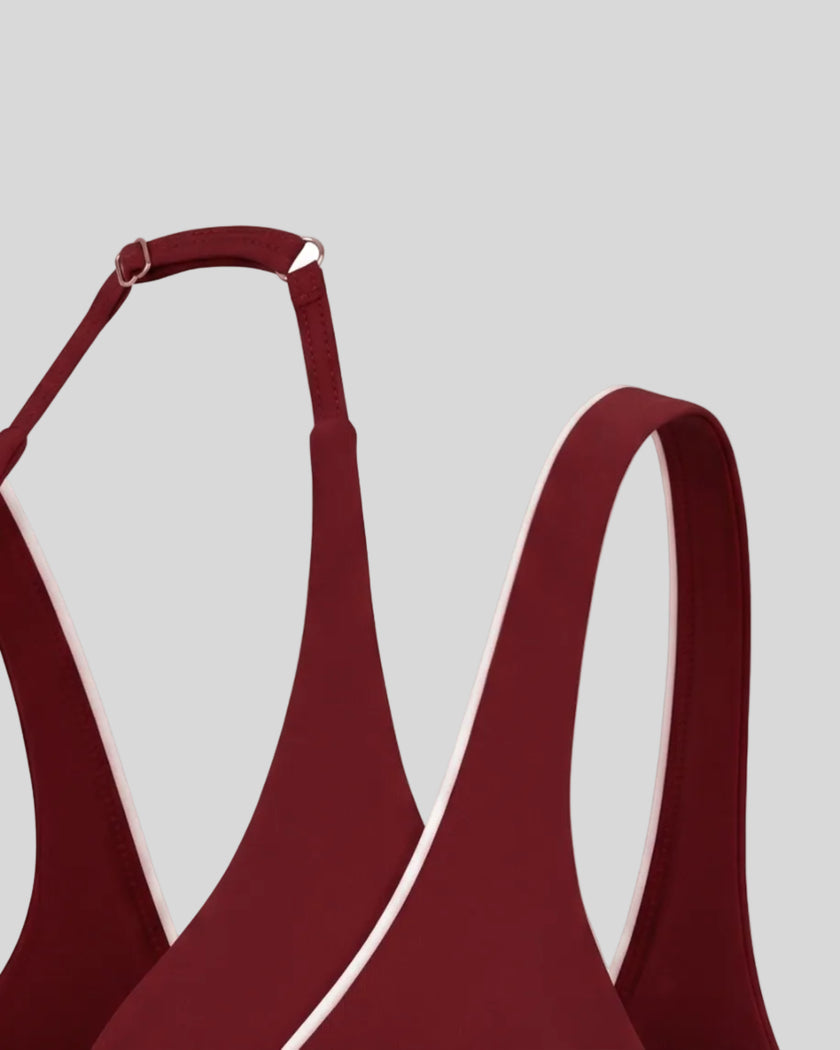 Angled view highlighting the halter silhouette and contrast trim of the TrackLine Riviera Sports Bra