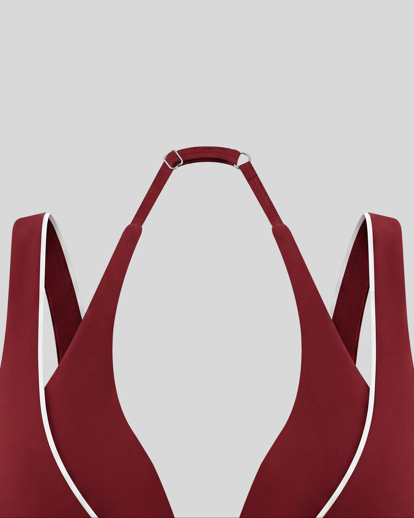 Deep V neckline and contrast piping detail of the TrackLine Riviera Sports Bra