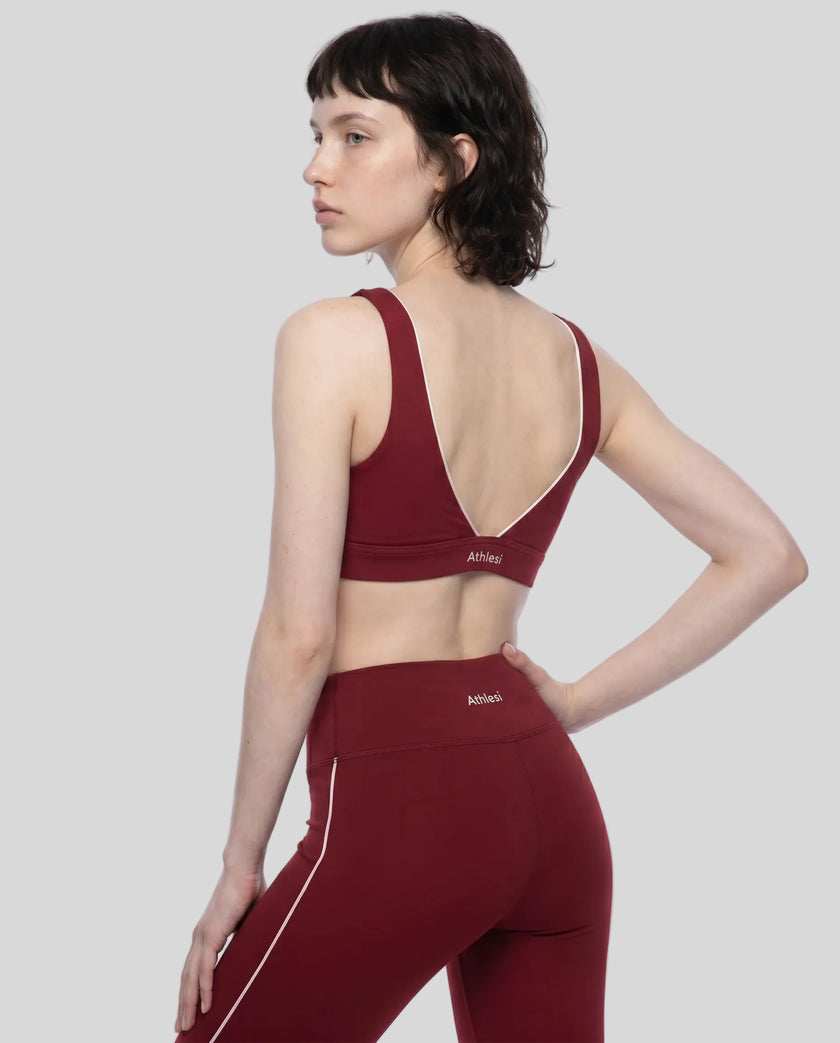 Angled back view of the TrackLine Riviera Sports Bra showcasing the open halter design and athletic silhouette