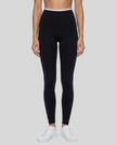 Model wearing TrackLine Sculpt Leggings in black and white front view