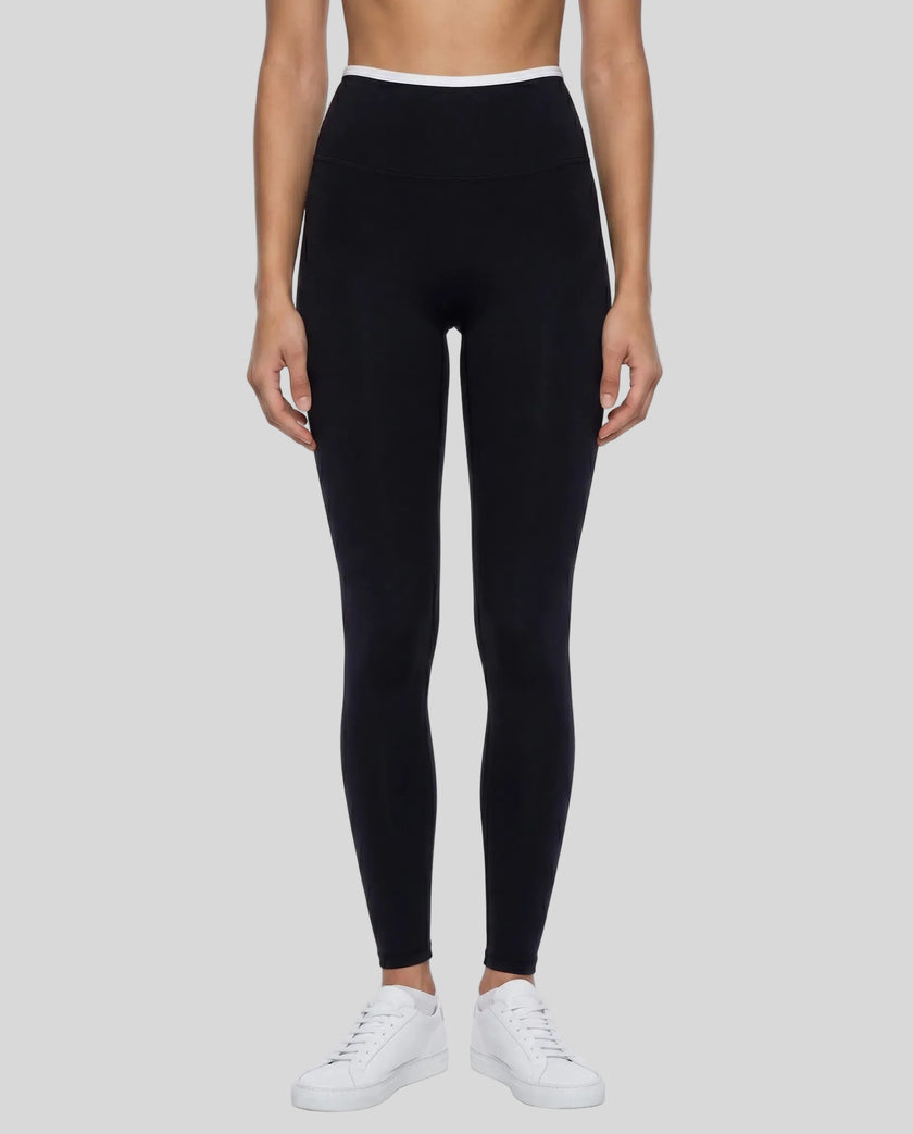 Model wearing TrackLine Sculpt Leggings in black and white front view