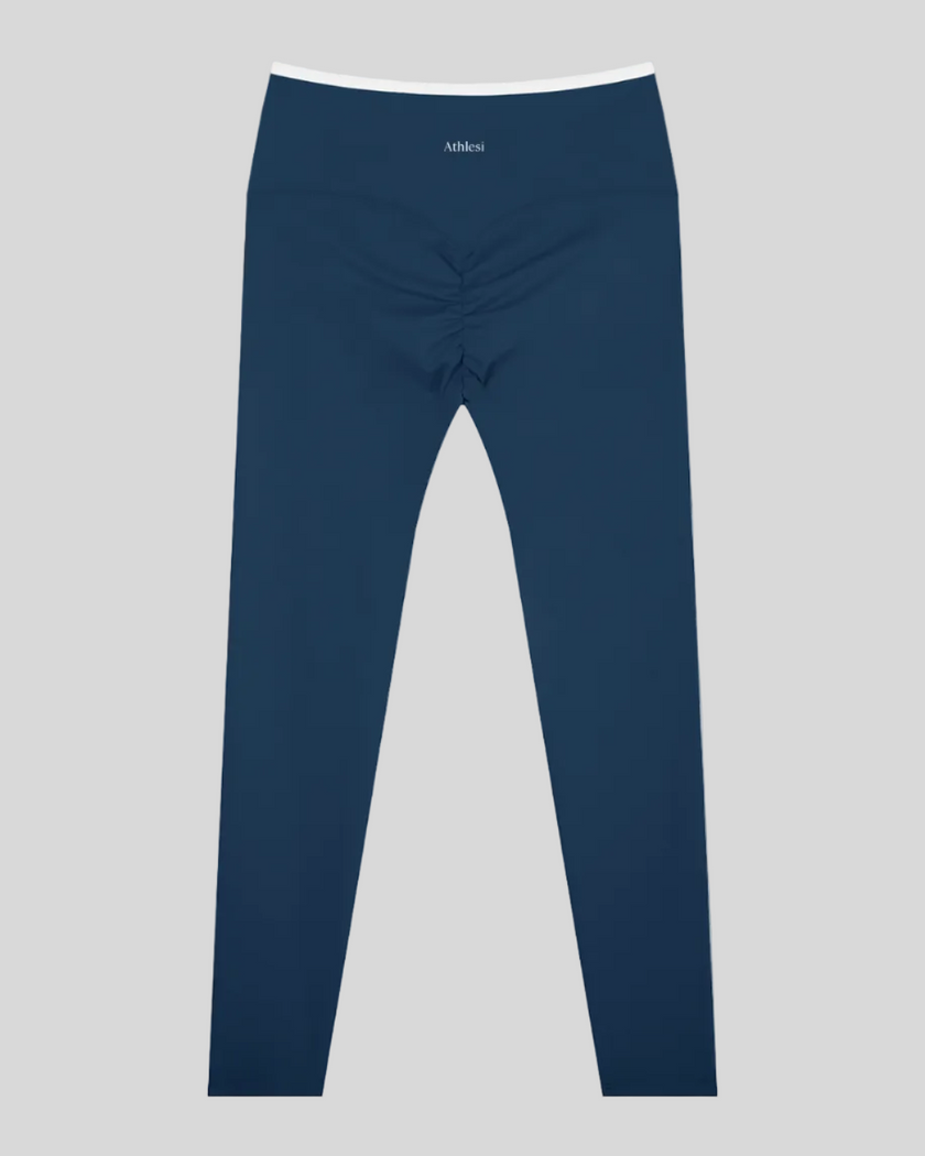 Back view of TrackLine Sculpt Leggings in blue and white with contour shaping and ruched detail
