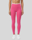 Model wearing TrackLine Sculpt Leggings in pink and white front view