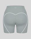 Back view of haze blue TrackLine Sculpt Shorts featuring distinctive curved white contrast piping