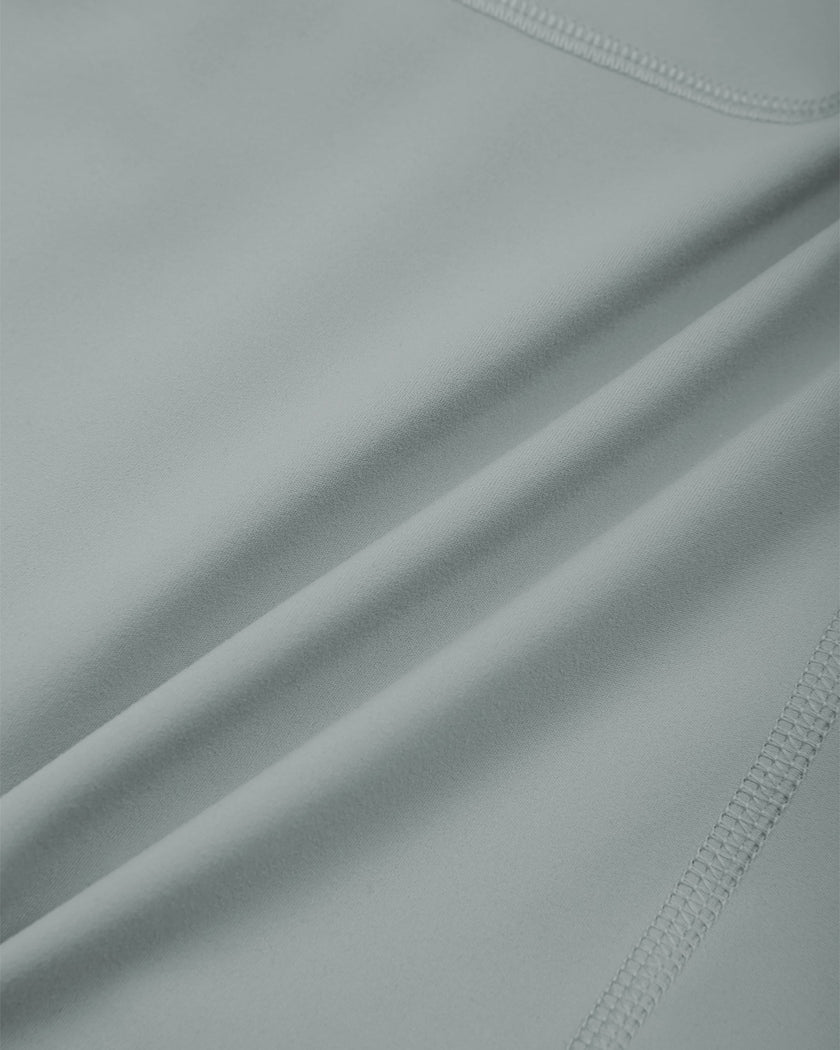 Closeup of smooth haze blue nylon-spandex stretch fabric on TrackLine Sculpt Shorts
