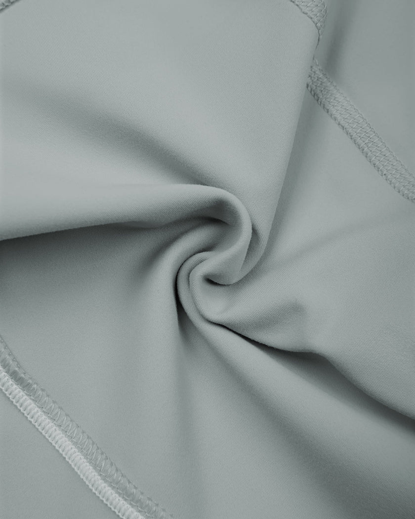 Detailed view of haze blue stretch fabric texture and stitching on TrackLine Sculpt Shorts