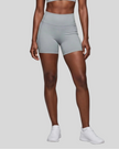Lower body front view of woman wearing haze blue TrackLine Sculpt Shorts with high-rise waistband