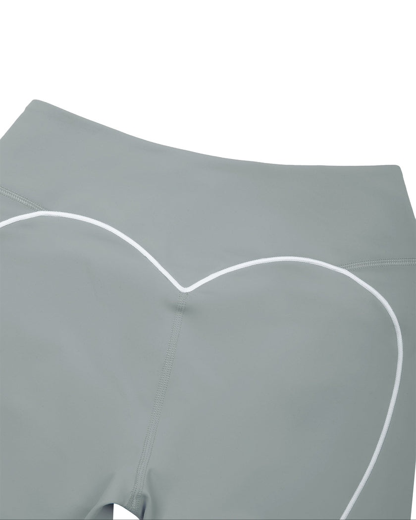 Closeup of back waistband and curved white piping detail on haze blue TrackLine Sculpt Shorts