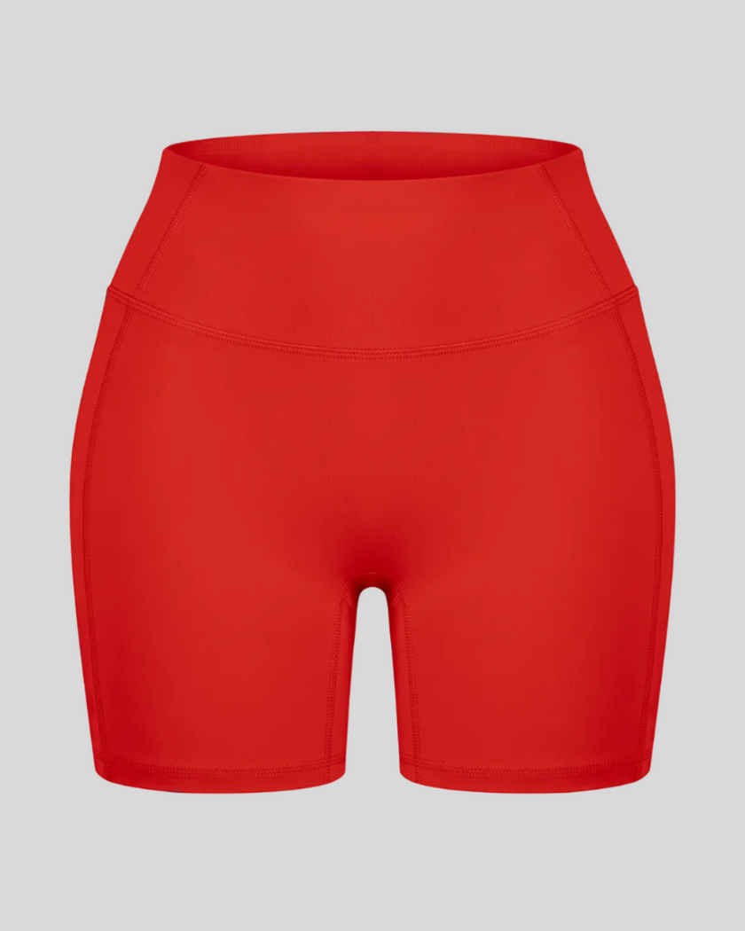 TrackLine Sculpt Shorts in red with high-rise waistband and fitted biker-short silhouette front view