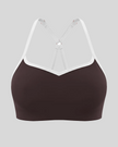 Front view of TrackLine Sculpt Sports Bra in brown with white contrast trim and V-neckline