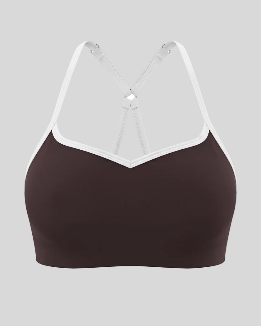 Front view of TrackLine Sculpt Sports Bra in brown with white contrast trim and V-neckline