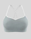 Front view of TrackLine Sculpt Sports Bra in haze blue with white contrast trim and V-neckline