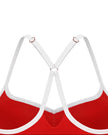 Closeup of white crossover back straps and metal ring details on TrackLine Sculpt Sports Bra