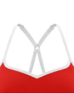 Closeup of V-shaped neckline with white contrast trim on red TrackLine Sculpt Sports Bra