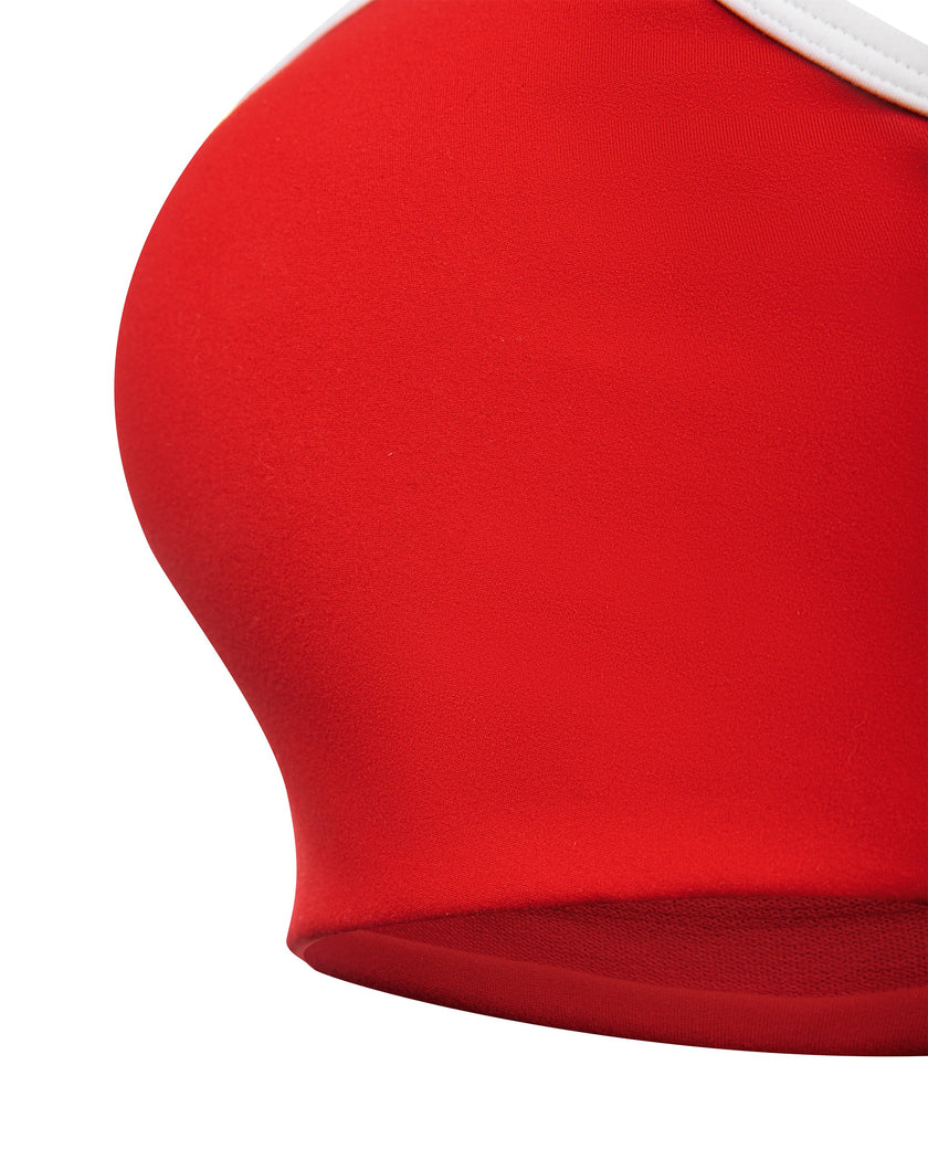 Closeup of smooth underbust band and stitching on red TrackLine Sculpt Sports Bra
