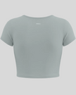 Back view of TrackLine Sculpt Tee in haze blue with short sleeves and subtle Athlesi logo
