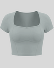TrackLine Sculpt Tee in haze blue with square-inspired neckline and contour stitching front view