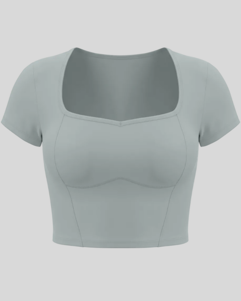 TrackLine Sculpt Tee in haze blue with square-inspired neckline and contour stitching front view
