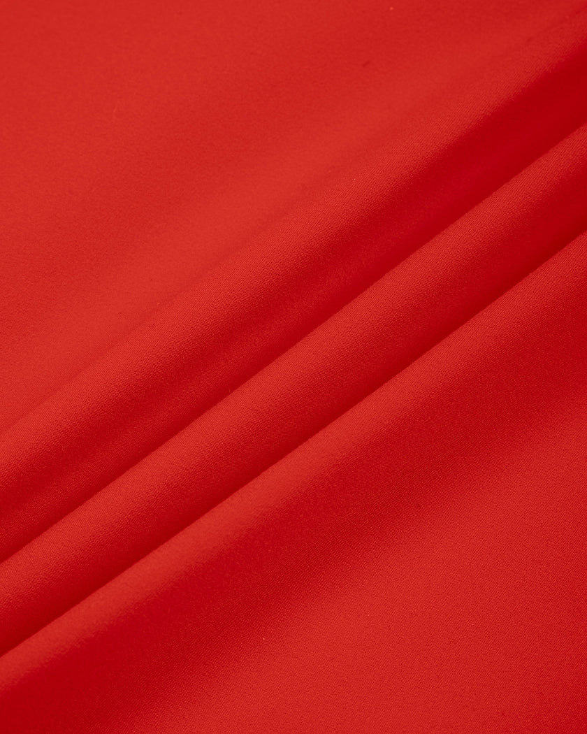 Closeup of red stretch nylon blend fabric on TrackLine Sculpt Tee