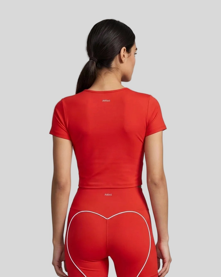 Upper body back view of woman wearing red TrackLine Sculpt Tee with subtle back logo