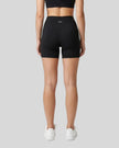 Back view of the TrackLine Sprint Shorts in black on model