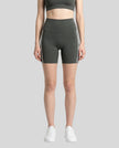 Model wearing the TrackLine Sprint Shorts in gray with black and white side stripes front view