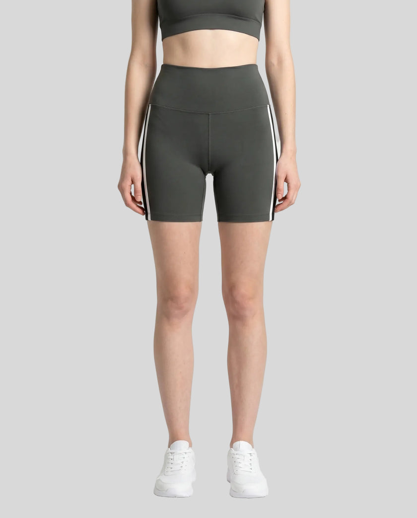 Model wearing the TrackLine Sprint Shorts in gray with black and white side stripes front view
