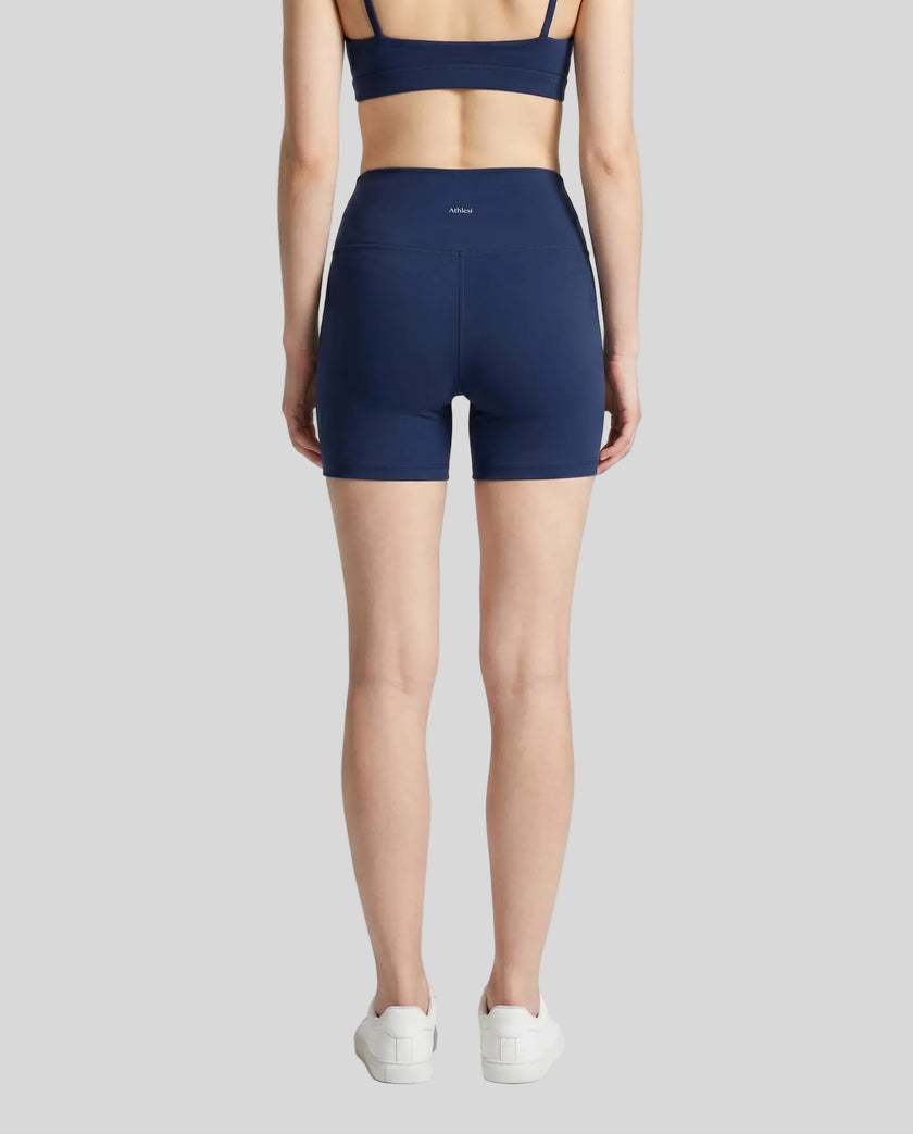 Back view of the TrackLine Sprint Shorts in navy blue on model