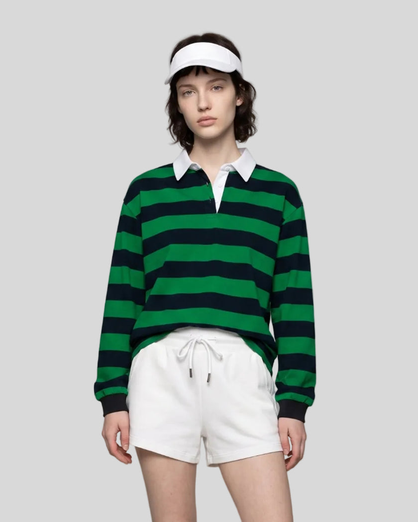 Model wearing the Athlesi TrackLine Striped Polo Shirt in green and navy blue, front view
