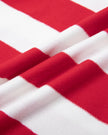 Close-up of the cotton stretch fabric on the red and white Athlesi TrackLine Striped Polo Shirt
