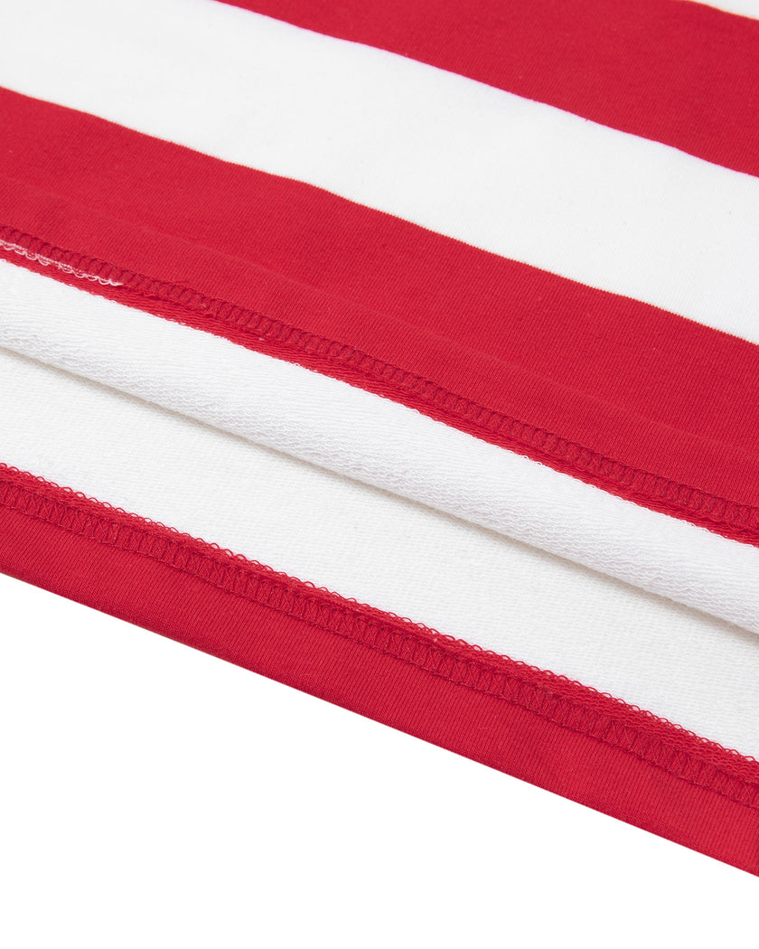 Close-up of the straight hem and striped design on the red and white Athlesi TrackLine Striped Polo Shirt
